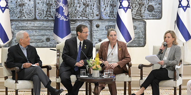 President and First Lady Herzog seated with Mandel Foundation leadership